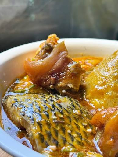 Banku with Okro stew comes with fish/chicken and fish