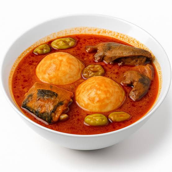 Rice ball(omo tuo) with groundnut soup comes with meat/chicken and intestines